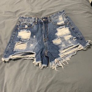 Ripped, high-waisted denim shorts